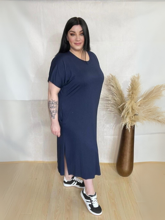 Model wearing AUSELILY Women's Summer Maxi Dress featuring short sleeves, side slit, rounded neck, and functional pockets – Comfortable and Casual Summer Outfit