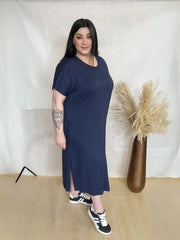 Model wearing AUSELILY Women's Summer Maxi Dress featuring short sleeves, side slit, rounded neck, and functional pockets – Comfortable and Casual Summer Outfit