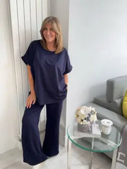 Light Scuba Co-Ord Set made from soft, breathable scuba fabric, available in five colours: navy, khaki, winter white, powder blue, and pink. Two-piece relaxed fit outfit available in Size 1 (UK 10–16) and Size 2 (UK 18–22), designed for all-day comfort and effortless style.