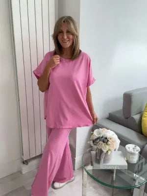 Light Scuba Co-Ord Set made from soft, breathable scuba fabric, available in five colours: navy, khaki, winter white, powder blue, and pink. Two-piece relaxed fit outfit available in Size 1 (UK 10–16) and Size 2 (UK 18–22), designed for all-day comfort and effortless style.