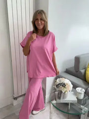 Light Scuba Co-Ord Set made from soft, breathable scuba fabric, available in five colours: navy, khaki, winter white, powder blue, and pink. Two-piece relaxed fit outfit available in Size 1 (UK 10–16) and Size 2 (UK 18–22), designed for all-day comfort and effortless style.
