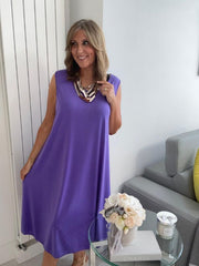 Plus-size women’s sleeveless swing midi dress in soft lightweight fabric, available in six colours including nude beige, hot pink, lavender purple, white, black, and taupe grey, designed for UK sizes 14–22.