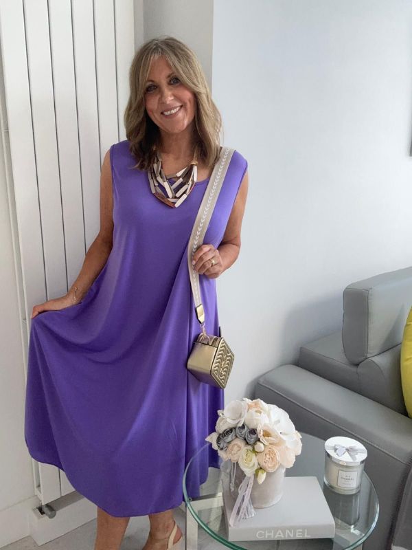 Plus-size women’s sleeveless swing midi dress in soft lightweight fabric, available in six colours including nude beige, hot pink, lavender purple, white, black, and taupe grey, designed for UK sizes 14–22.