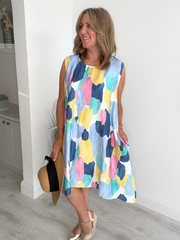 Printed sleeveless mini dress with A-line fit and side pockets – lightweight and breathable, free size fits 8–20