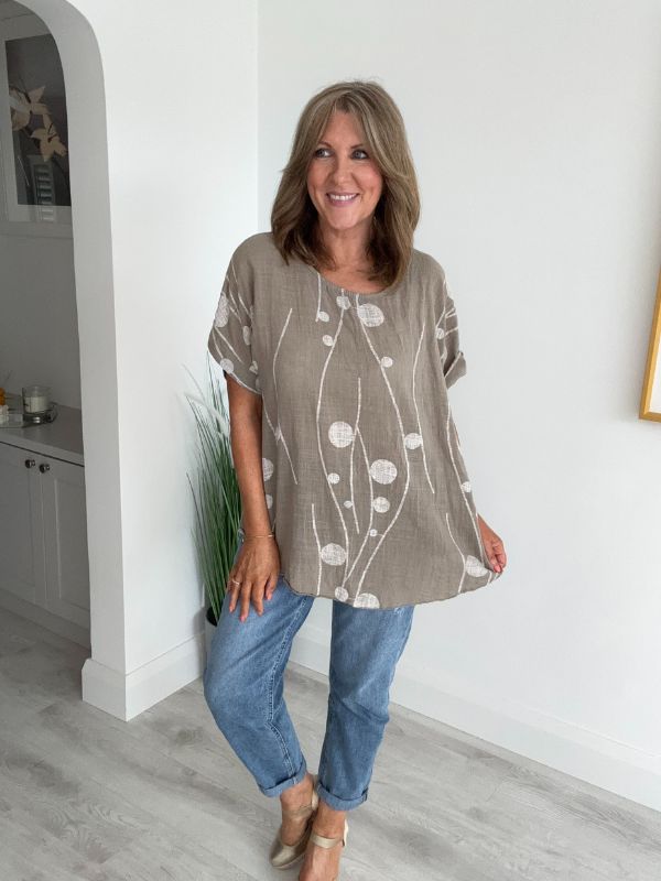 Women’s cotton half sleeve top with rolled cuffs, featuring a relaxed fit and abstract dot and vine print, available in vibrant colours and UK sizes 8–20.