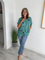 Women’s cotton half sleeve top with rolled cuffs, featuring a relaxed fit and abstract dot and vine print, available in vibrant colours and UK sizes 8–20.