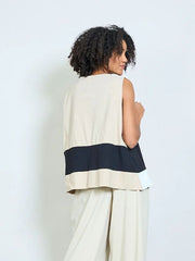 Geometric panel sleeveless asymmetric top with front flap and button detail