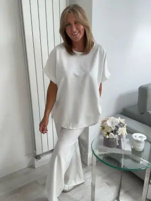 Light Scuba Co-Ord Set made from soft, breathable scuba fabric, available in five colours: navy, khaki, winter white, powder blue, and pink. Two-piece relaxed fit outfit available in Size 1 (UK 10–16) and Size 2 (UK 18–22), designed for all-day comfort and effortless style.