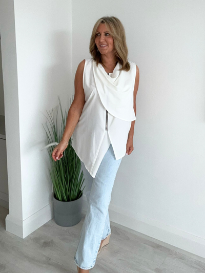 Vintage sleeveless waistcoat with asymmetric hem, front zip, and side button in breathable cotton blend – fits sizes 8-20