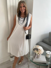Plus-size women’s sleeveless swing midi dress in soft lightweight fabric, available in six colours including nude beige, hot pink, lavender purple, white, black, and taupe grey, designed for UK sizes 14–22.
