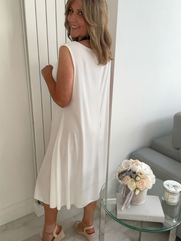 Plus-size women’s sleeveless swing midi dress in soft lightweight fabric, available in six colours including nude beige, hot pink, lavender purple, white, black, and taupe grey, designed for UK sizes 14–22.